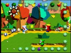 Yoshi bleu ciel suit Poochy le chien pour trouver des fruits, tout en faisant attention aux Maskass dans le jeu Yoshi's Story sur Nintendo 64 (Yoshi's Story)