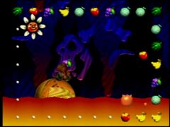 Yoshi roule sur une pierre dans le niveau Soupe de Blargg du jeu Yoshi's Story sur Nintendo 64 (Yoshi's Story)