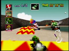 Si Toad, négocie bien sa trajectoire, il peut prendre le raccourci  qui est au fond et permet de traverser la montagne ! (Mario Kart 64)