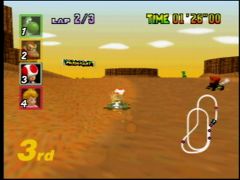 Aïe, Toad va être bien ralenti par cette sortie de piste. Le caramel, ça colle aux roues ! (Mario Kart 64)