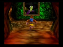 Banjo entre dans le repère de la sorcière Gruntilda (Banjo-Kazooie)