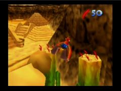 Banjo et Kazooie en phase de vol grâce aux plumes rouges dans le niveau désert de Gobi (Banjo-Kazooie)