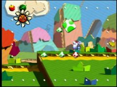 Yoshi bleu ciel récupère des oeufs dans un niveau du jeu Yoshi's Story sur Nintendo 64 (Yoshi's Story)