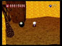 Une bombe bien placée fera tomber ce rocher (Bomberman 64)
