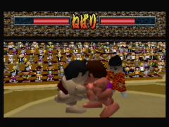 One sumo wrestler is about to push his opponent out of the dohyo (64 Oozumou 2)